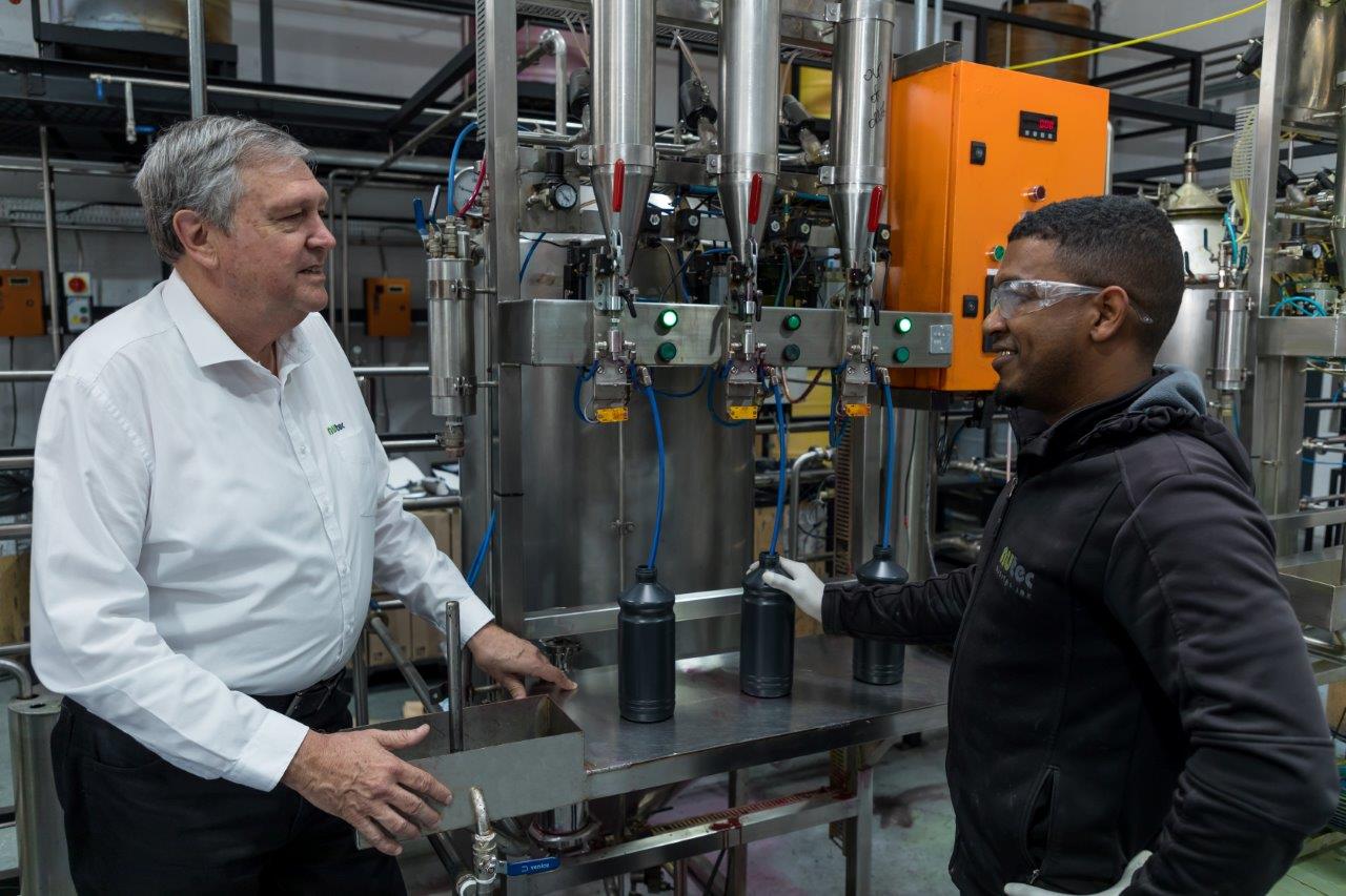 NUtec Digital Ink's water-based ink production facility with Sales and Marketing Director Neil Green on the left, showcasing water-based ink manufacturing processes