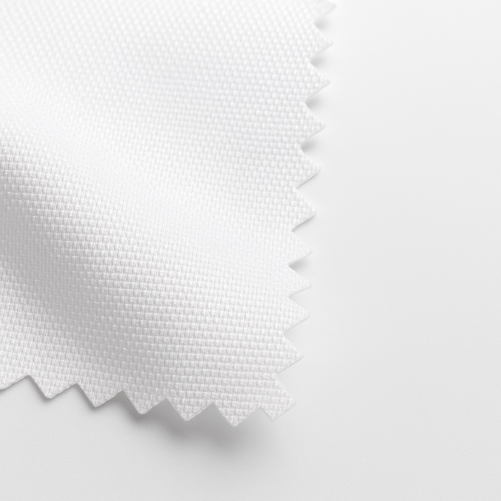Close-up of a white, textured 100{d8a0dacfdda424957de4b2f4f276d086800de00c237c9f2b0ea69416263fb88a} polyester fabric swatch with a scalloped edge, ideal for dye-sublimation.
