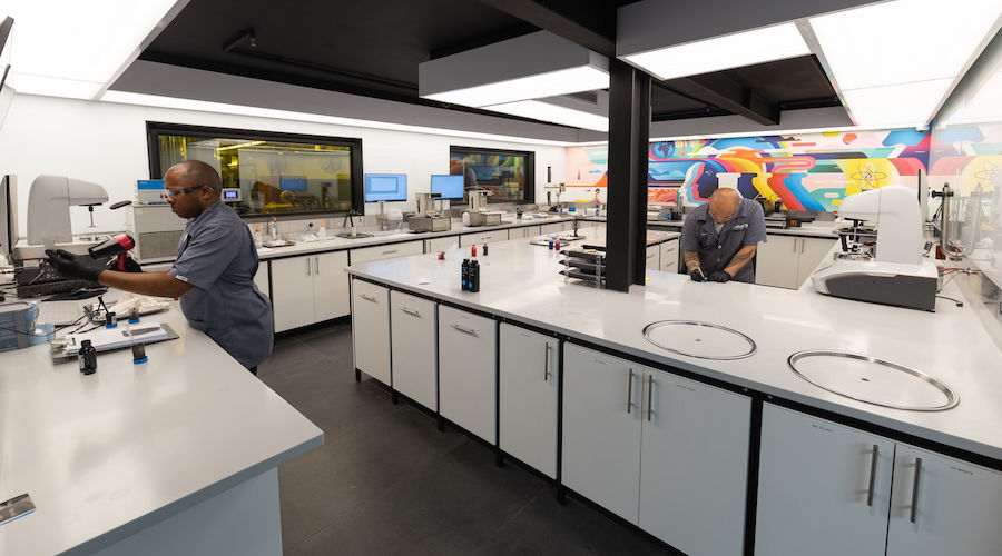 NUtec Digital Ink modern lab with technicians working on digital printing ink development and testing in a high-tech facility